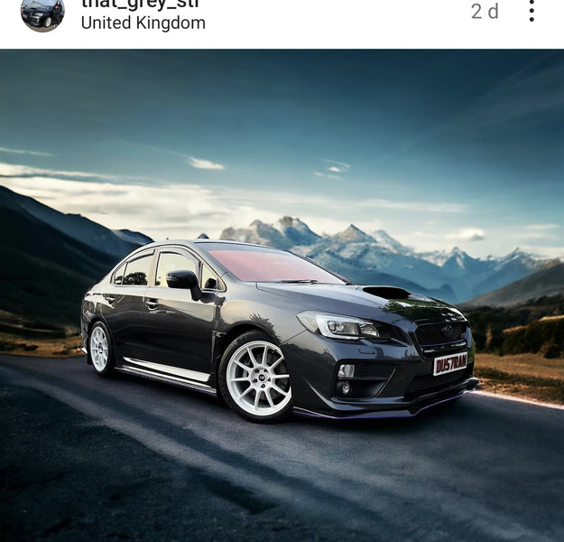 Grey Subaru STi with some 4D plates