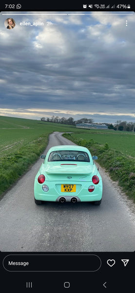 Diahatsu Copen with some square 4D plates